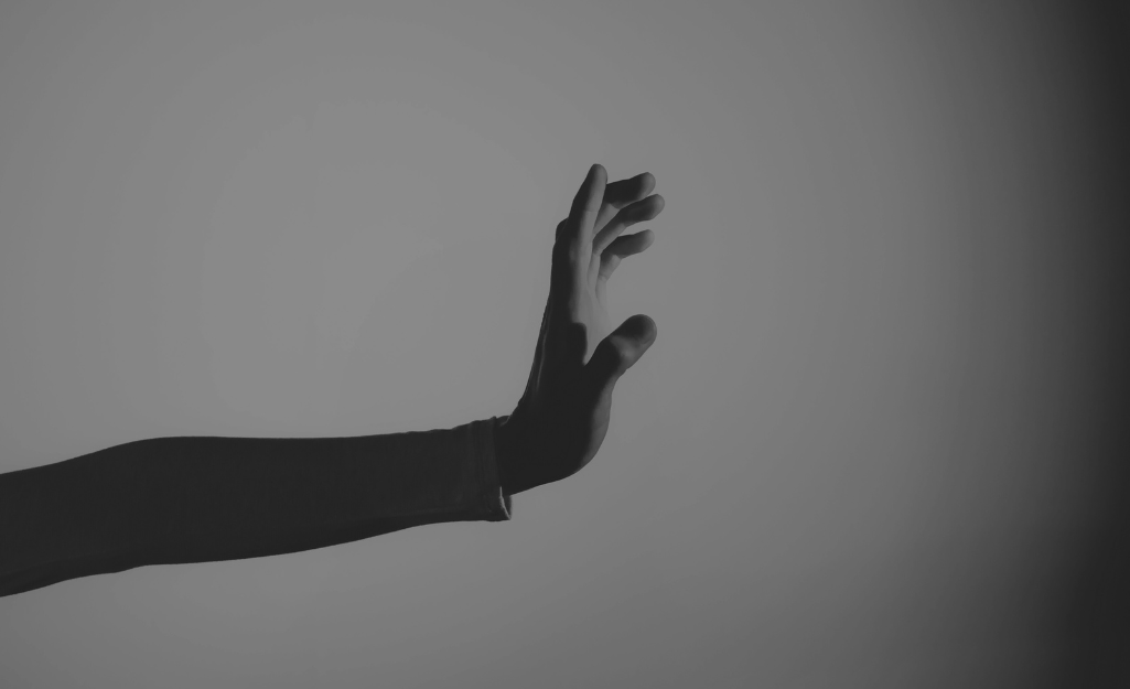 a person reaching out toward something