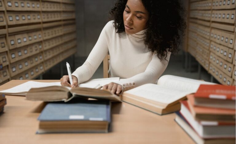a person working on a research paper analyzing data