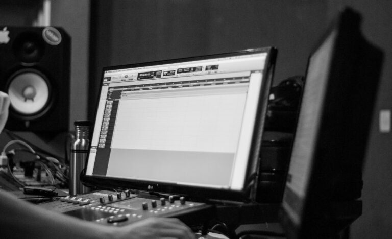 a person working on an audio file to add to their presentation