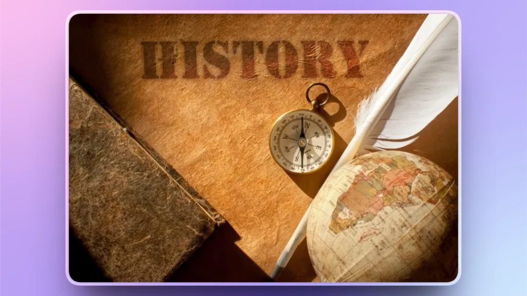 Vintage compass, old globe, feather quill, and textured book on parchment with "HISTORY" text.