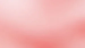 Abstract soft pink gradient background with smooth color transitions.