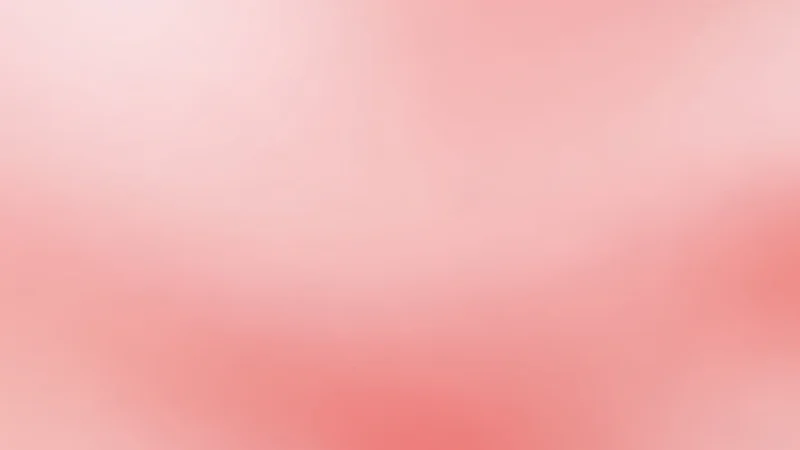Abstract soft pink gradient background with smooth color transitions.