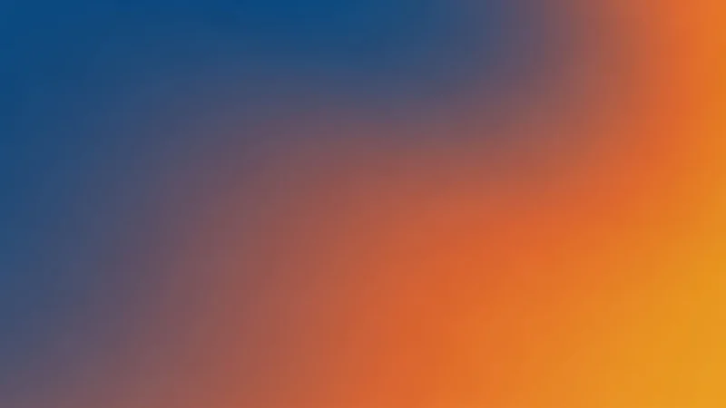 Gradient background transitioning from dark blue to orange and yellow hues.