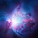 Vibrant purple and blue nebula surrounded by numerous bright stars in deep space.