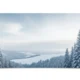 Panoramic winter landscape featuring snow-covered pine trees and rolling hills under a cloudy sky.