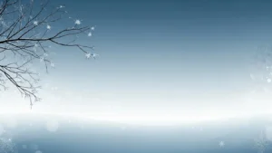 Winter landscape with bare tree branches and falling snowflakes against a blue gradient sky.