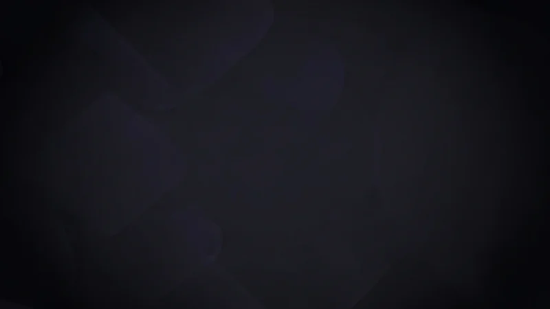 Abstract dark background with subtle overlapping geometric shapes in deep blue and black tones.
