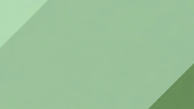 Abstract geometric background with overlapping shapes in varying shades of green.