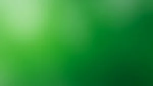 Abstract green gradient background with light and dark shades blending smoothly.