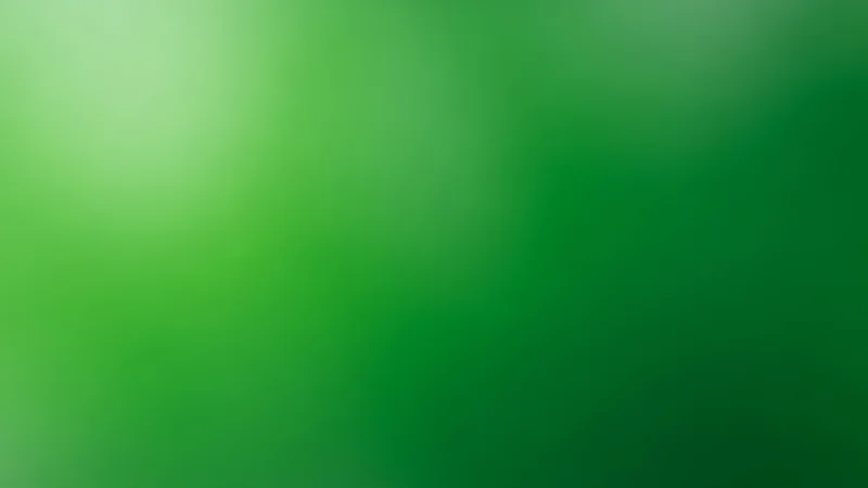 Abstract green gradient background with light and dark shades blending smoothly.