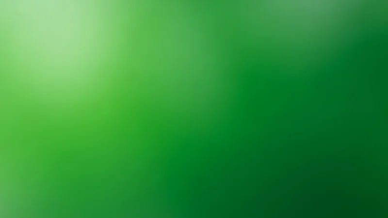 Abstract green gradient background with light and dark shades blending smoothly.