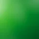 Abstract green gradient background with light and dark shades blending smoothly.