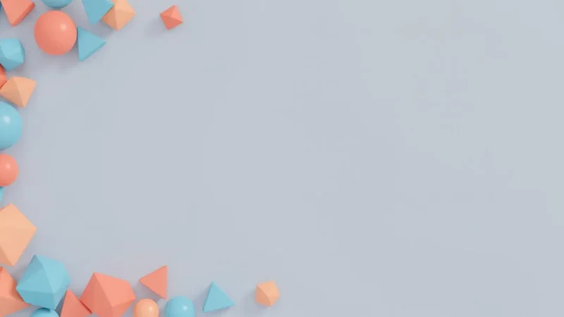 Pastel-colored geometric shapes in blue, peach, and coral arranged on a light gray background.