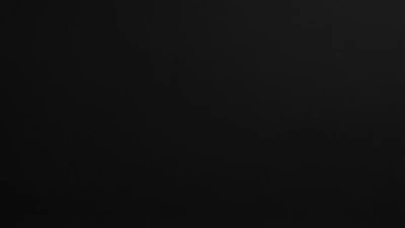 Black abstract background with subtle gradients and smooth texture.