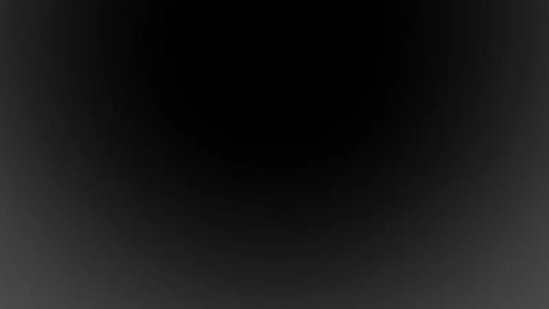 Black gradient background transitioning from dark gray to black.