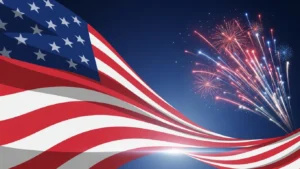 Waving American flag with red, white, and blue fireworks exploding against dark sky.