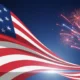 Waving American flag with red, white, and blue fireworks exploding against dark sky.