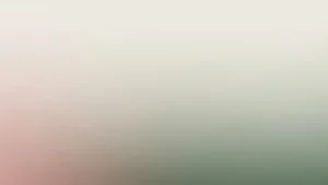 Blurred gradient background with soft tones of beige, pink, and green.