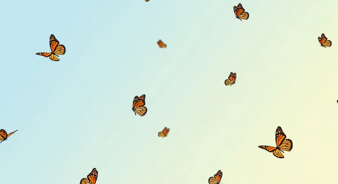 Orange and black monarch butterflies flying against a gradient blue to pale yellow sky.