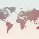 Faded world map with continents in gradient shades of gray and red on a light background.