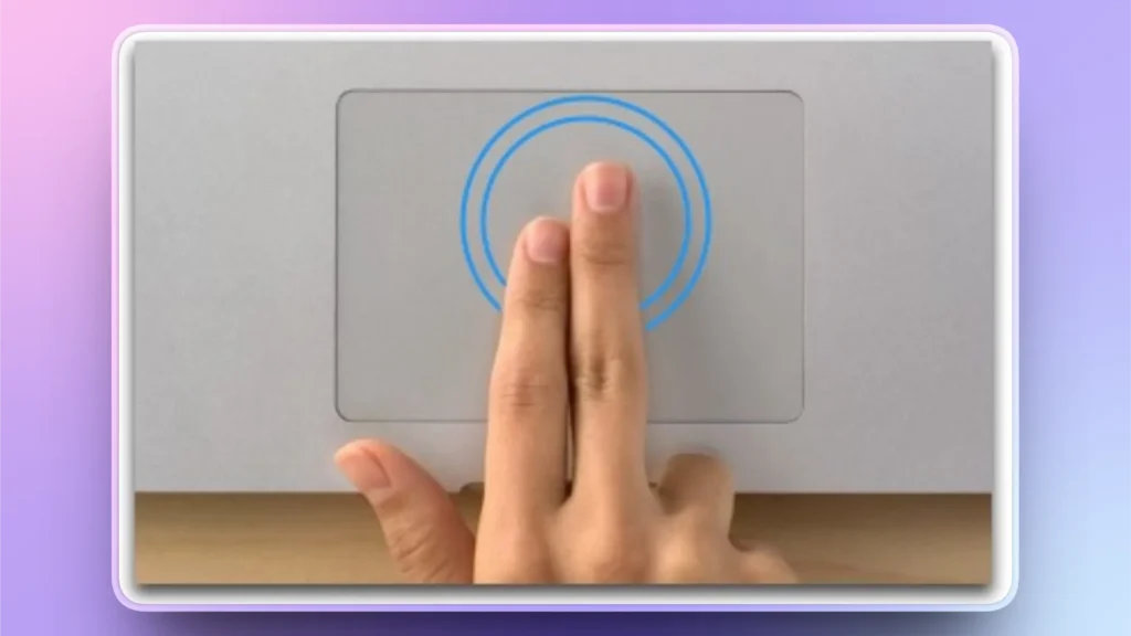 Close-up of a hand performing a two-finger gesture on a laptop touchpad with blue circular indicators.