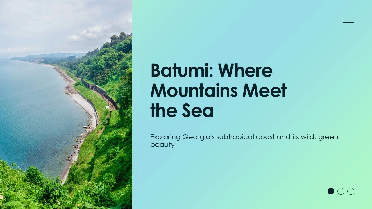 Coastal landscape of Batumi with green mountains meeting the calm sea under a cloudy sky.