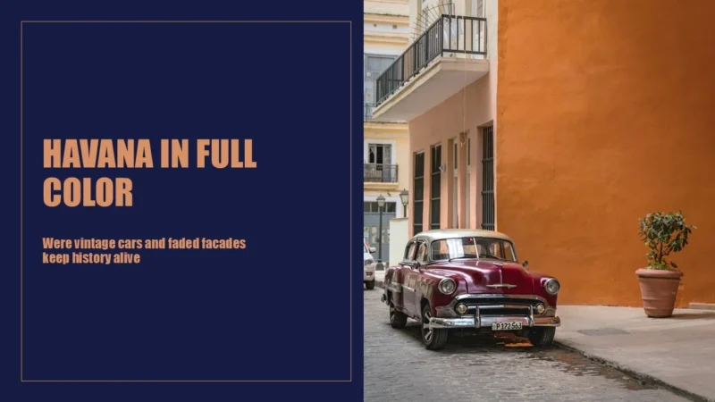 havana-title Vintage maroon car parked on a cobblestone street beside orange and peach building facades.