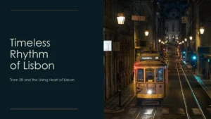 Nighttime view of yellow Tram 28 on illuminated street in Lisbon, Portugal.