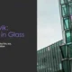 Modern glass building with hexagonal windows beside text about Reykjavik's architectural theme.