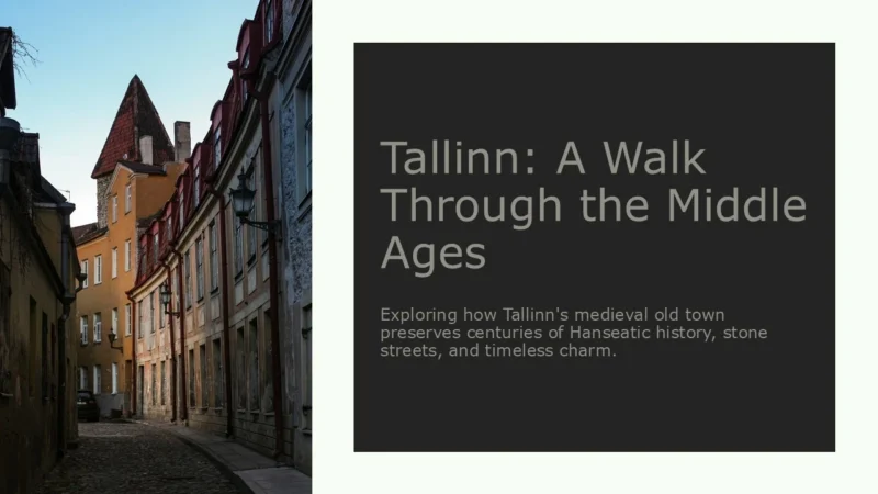 tallinn-title Cobblestone street in Tallinn's medieval old town with historic buildings and a pointed tower.
