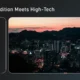 Nighttime cityscape with illuminated skyscrapers under a pink and orange sunset sky.