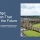 Aerial view of historic Cambridge University buildings with green lawns and partly cloudy sky.