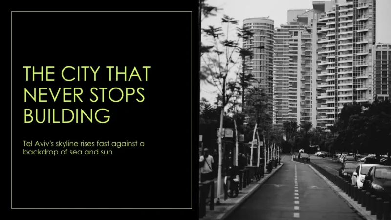 title Black and white photograph of a modern city street with high-rise buildings and parked cars.